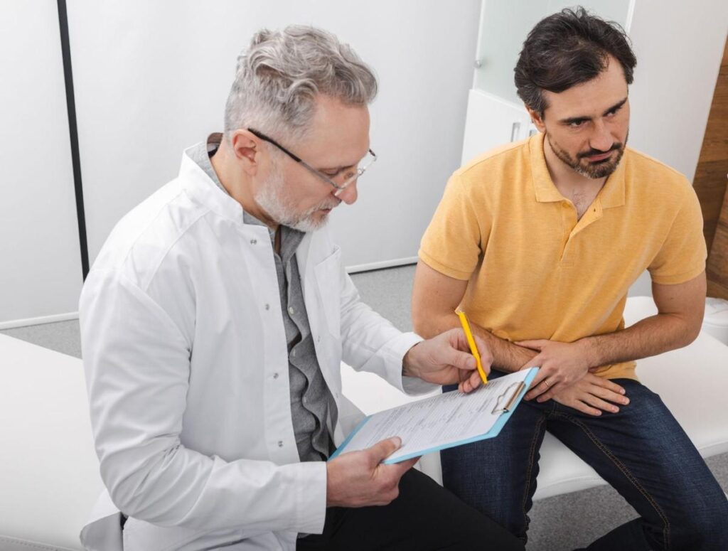 Patient discussing recovery after BPH treatment with a urologist during a follow-up consultation